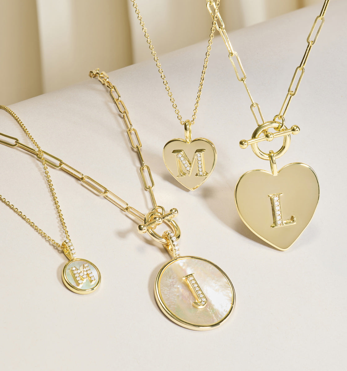 Love Letters Necklaces collection on a light background