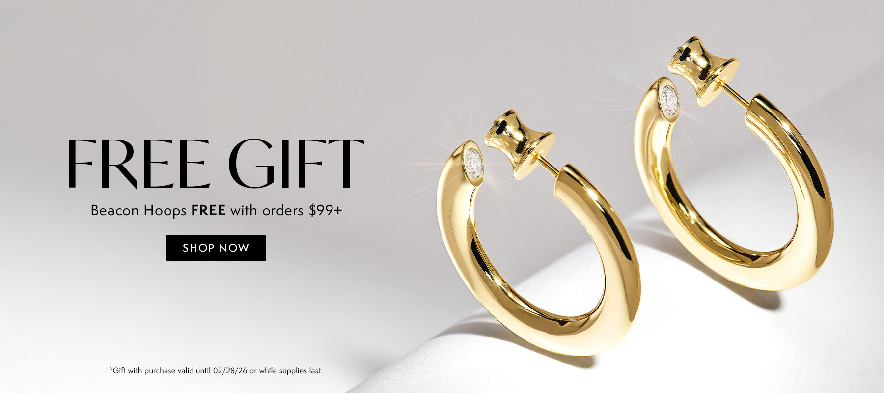 Gold hoop earrings on a light gray background with promotional text.