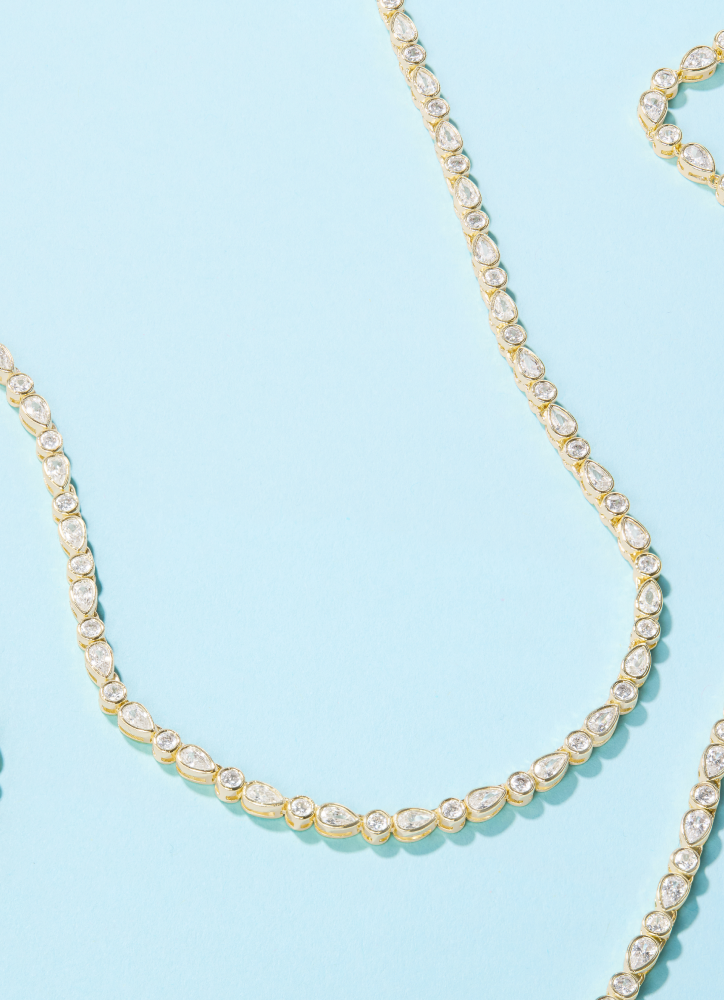 NEW Isla Tennis Necklace on blue background