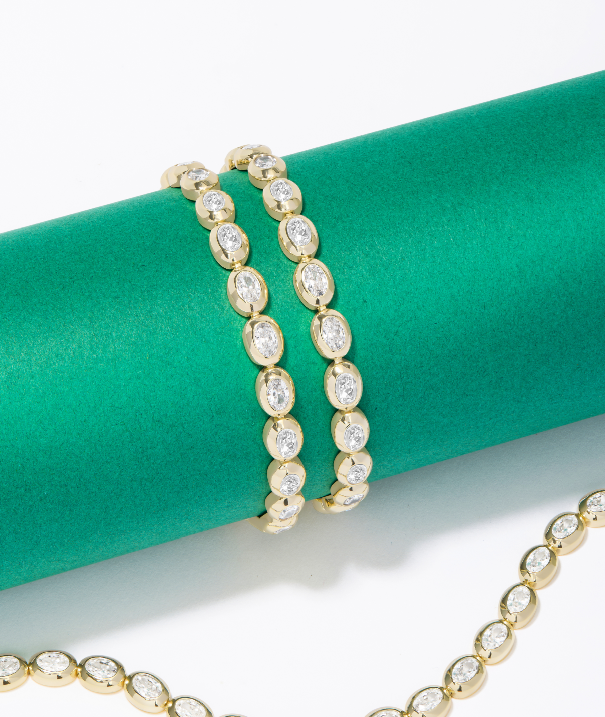 NEW She's a Boss Tennis Bracelet on a green background