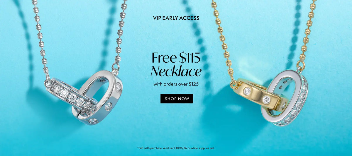 Promotional banner showing two interlocking ring necklaces on a bright aqua background: one silver with clear stones and one gold with clear stones. Text reads 'VIP EARLY ACCESS', 'Free $145 Necklace with orders over $125', and a 'SHOP NOW' button.