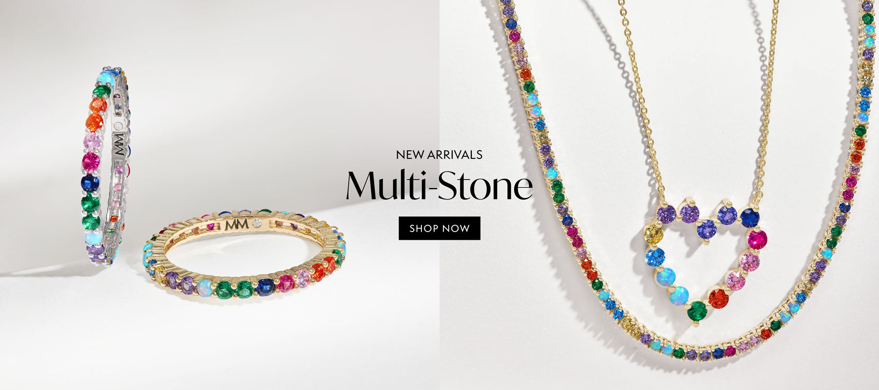 Multicolored jewelry set including a necklace and bracelets on a white background with 'New Arrivals Multi-Stone' text.