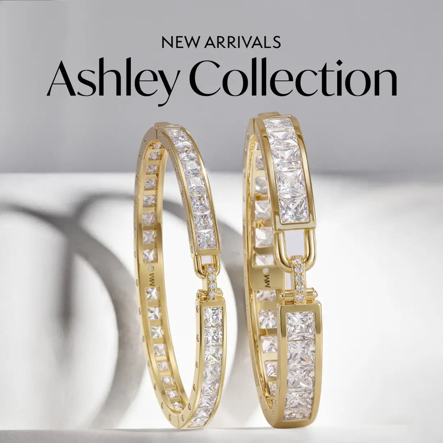 Two gold cuff bracelets with rectangular clear pavé stones, shown against a light gray background with the text 'NEW ARRIVALS Ashley Collection' at the top.