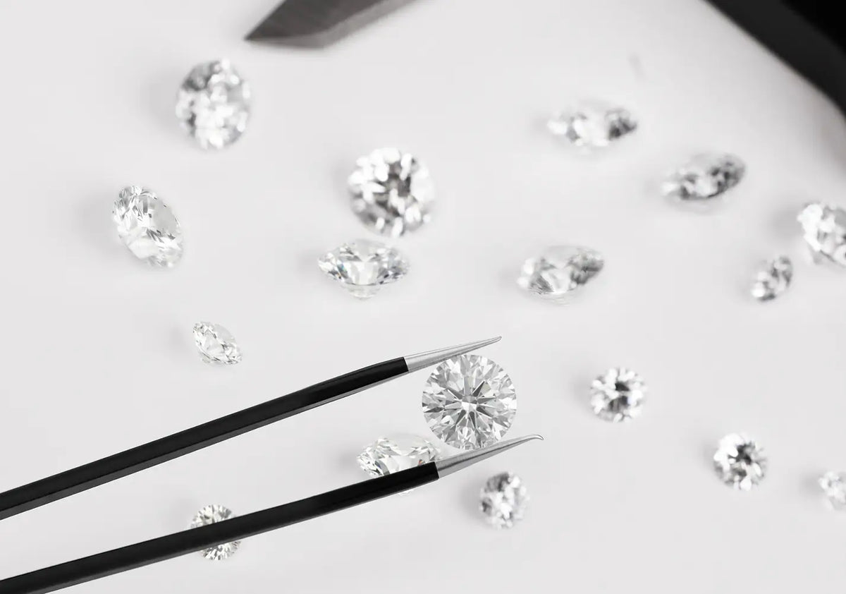 Jeweler inspecting cut diamonds