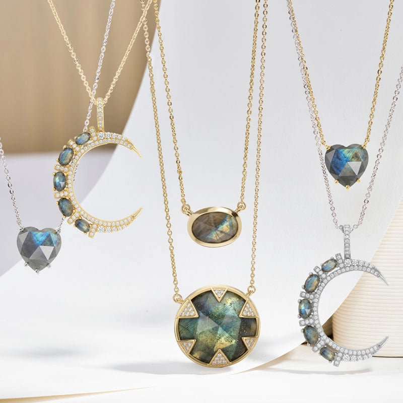 Bestselling Labradorite Necklaces hanging in front of a white background