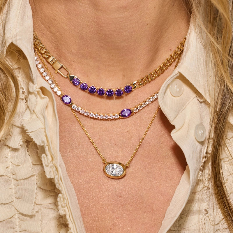 Model wearing our NEW Lavender Amethyst necklaces with a cream collared shirt.
