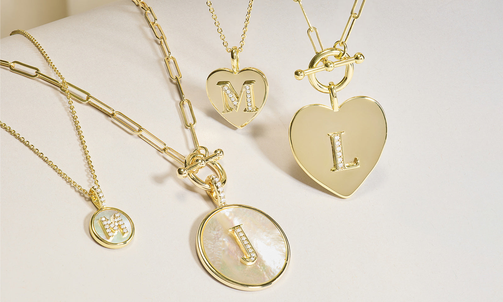 An assortment of love letters medallion necklaces
