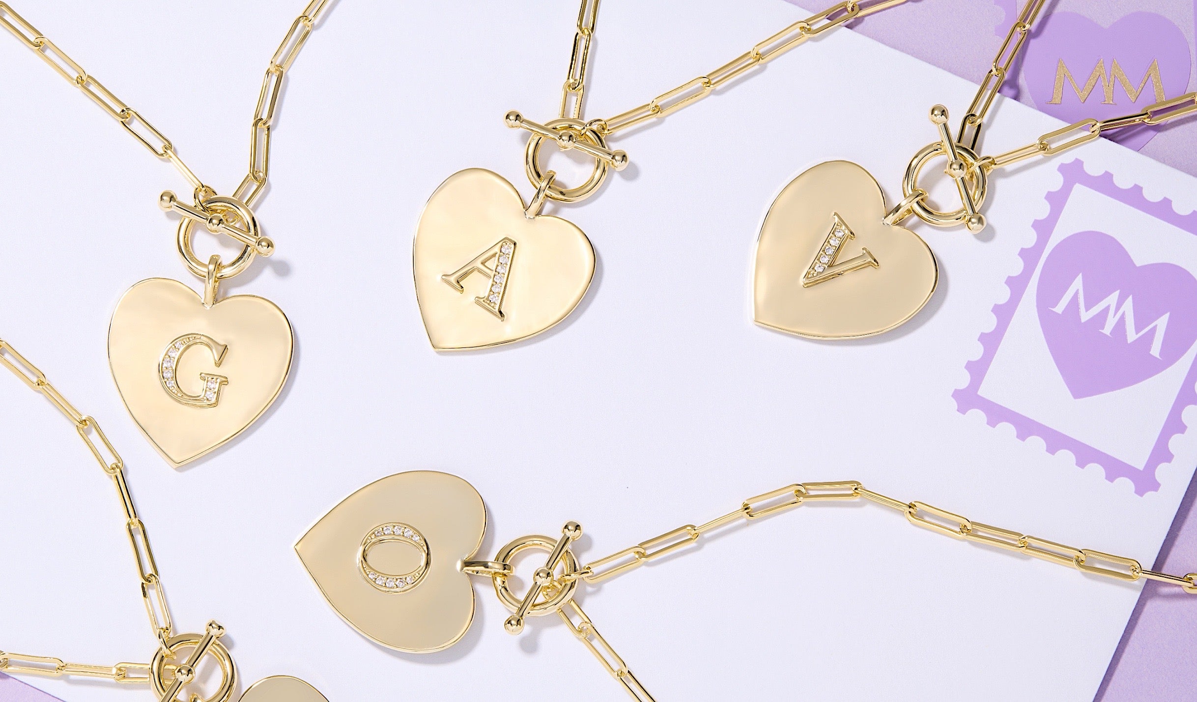 A collection of various medallion initial necklaces