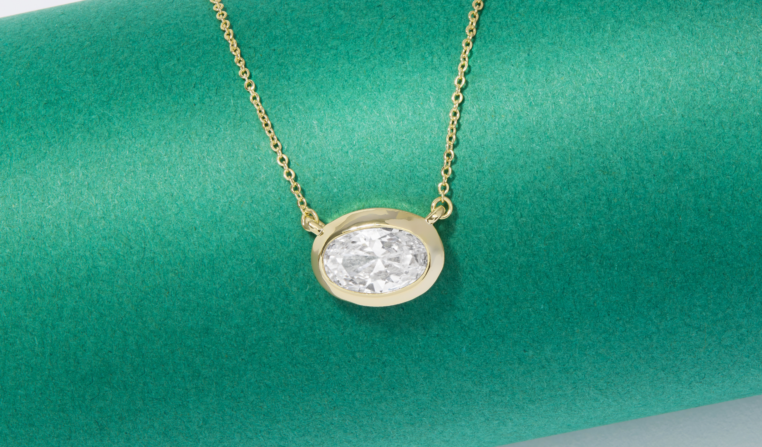 NEW She's a Boss Pendant Necklace on a green background